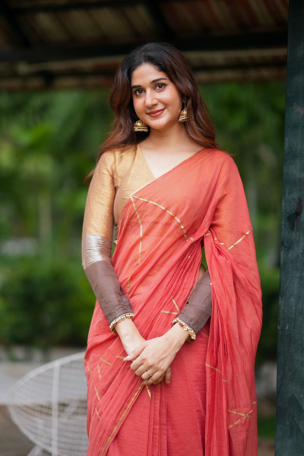 Orange rust saree with tissue handwork blouse