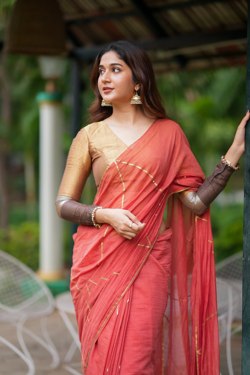 Orange rust saree with tissue handwork blouse