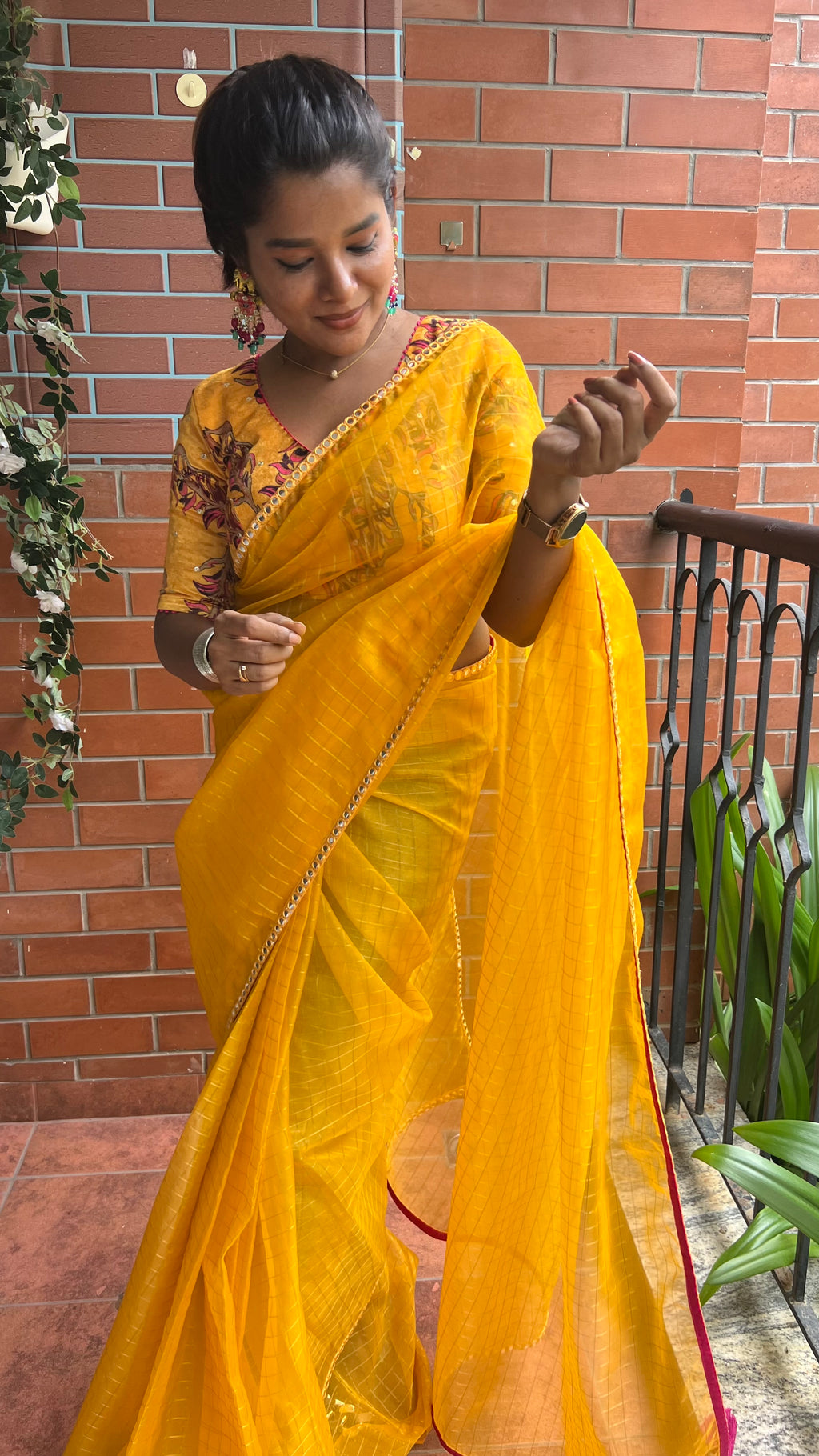 Yellow checked organza saree with velvet embroidery blouse