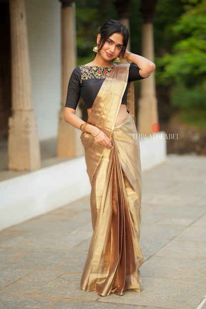 Golden tissue saree with black hand work blouse
