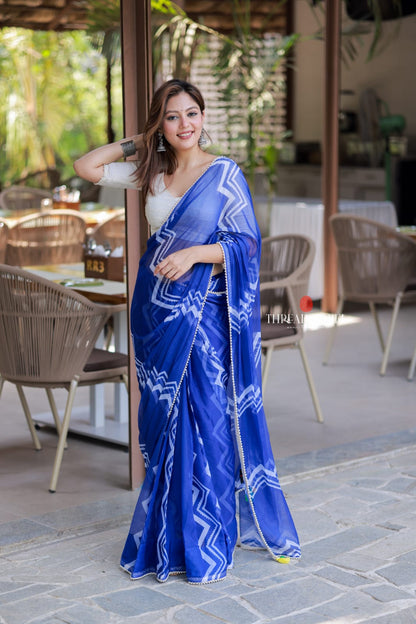 Blue chiffon saree with white embroidery blouse