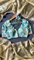 Golden soft tissue saree with blue floral embroidery blouse