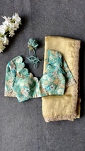 Golden soft tissue saree with blue floral embroidery blouse