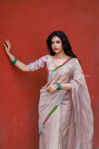 Dusty silver tissue saree with pearl hand work blouse