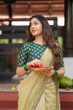 Gold tissue saree with green hand work blouse