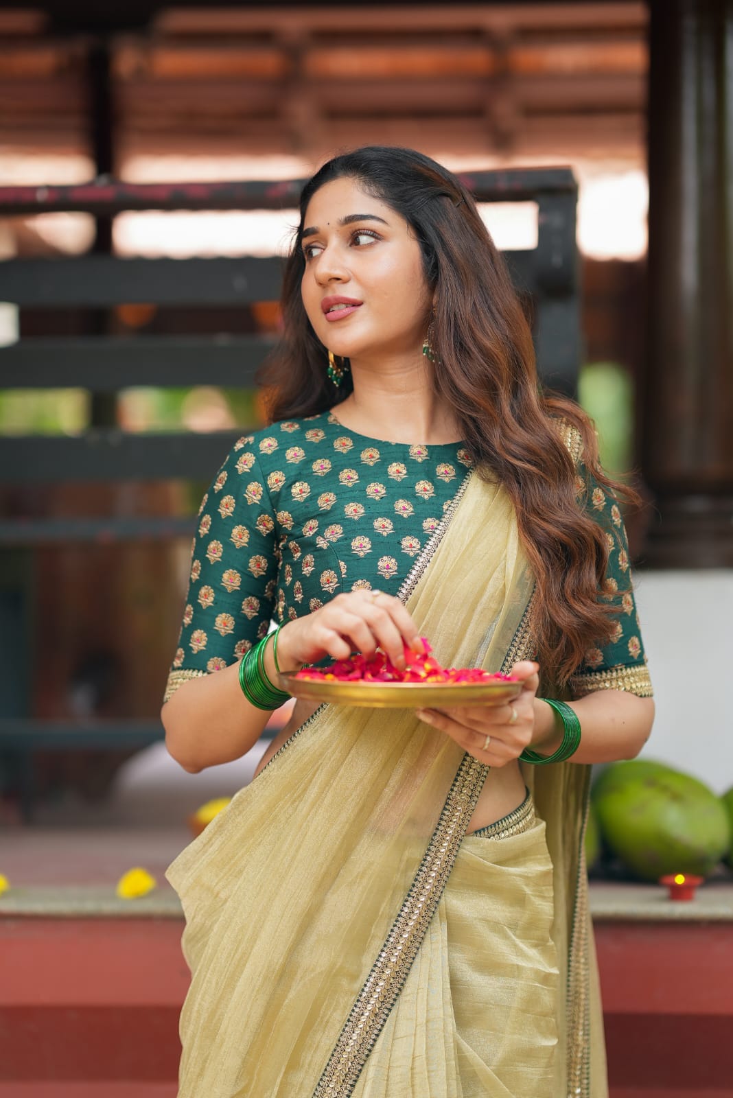 Gold tissue saree with green hand work blouse
