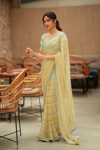 Western yellow & blue chiffon striped saree with hand work blouse