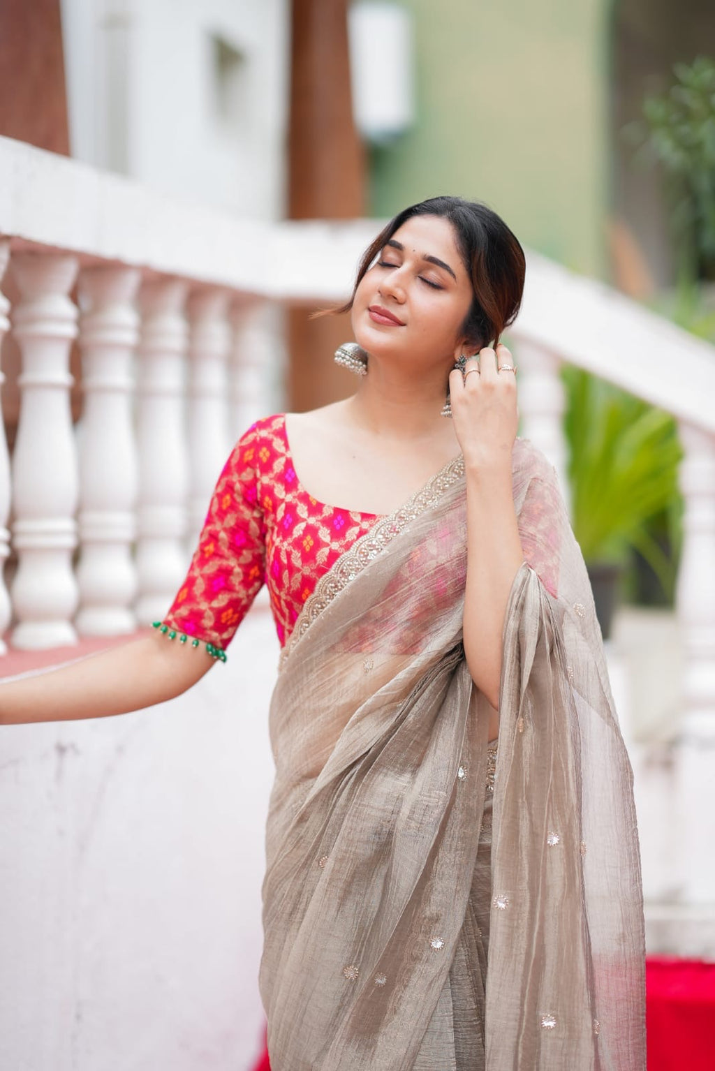 Grey tissue saree with red banarasi blouse