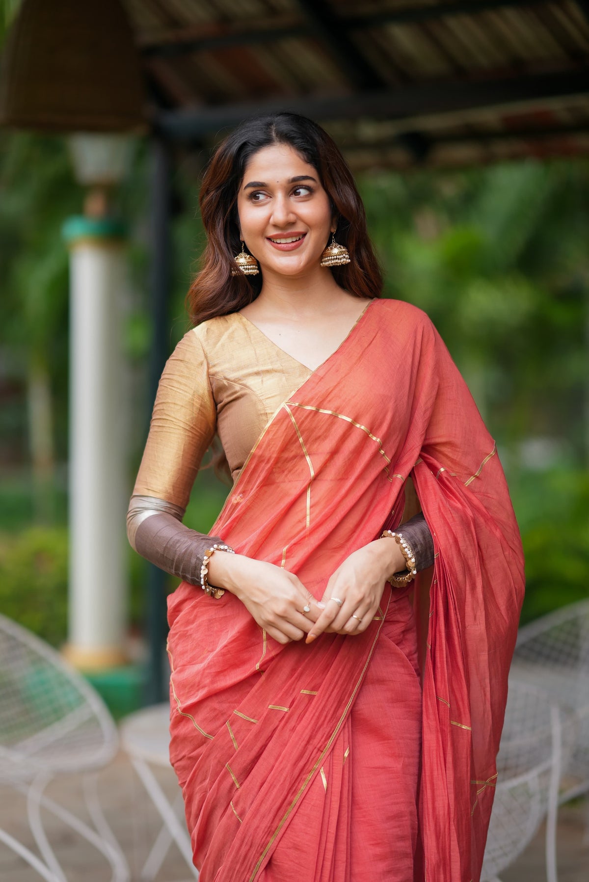 Orange rust saree with tissue handwork blouse