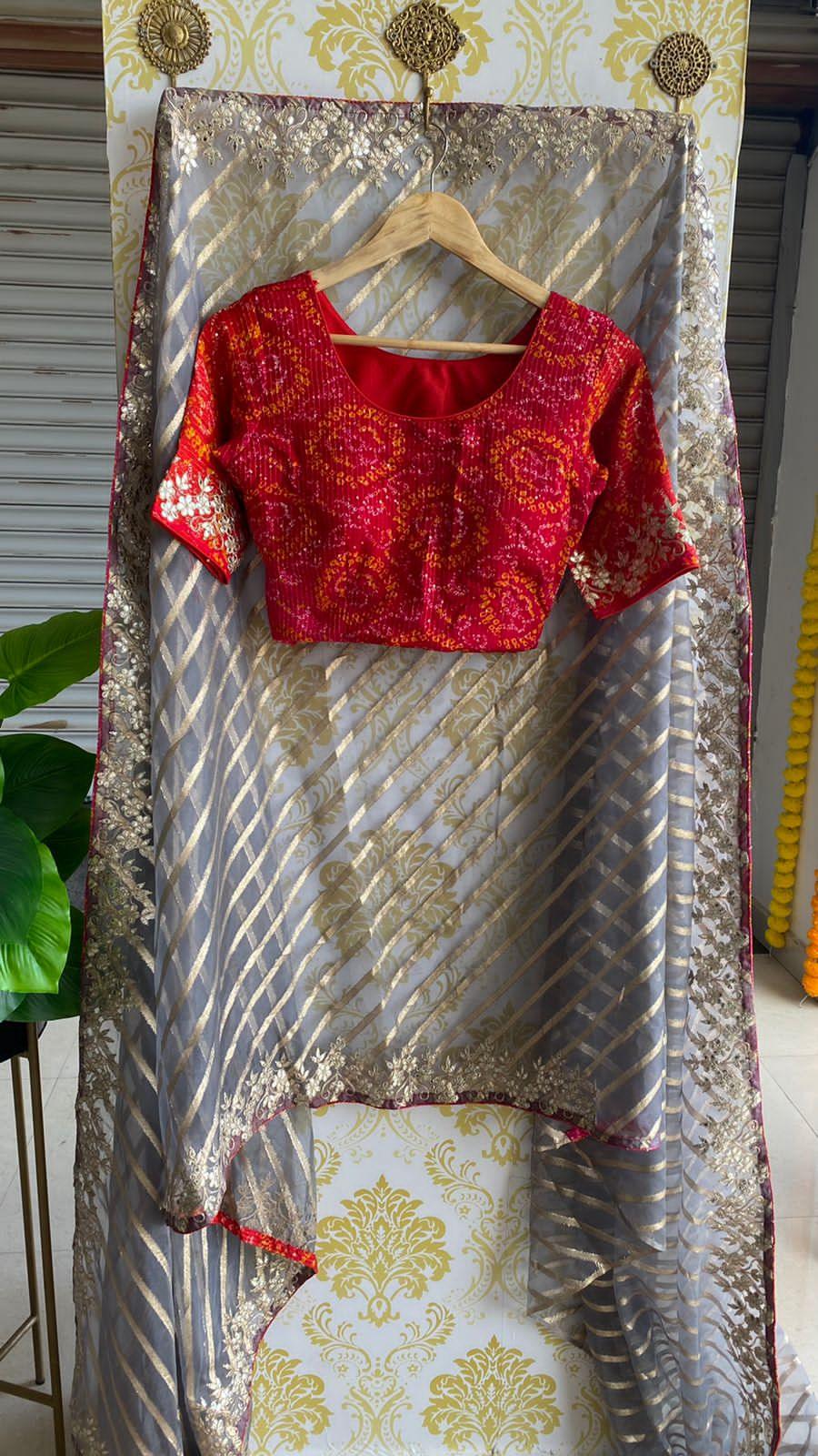 Striped grey organza saree with chiffon embroidery blouse - Threads