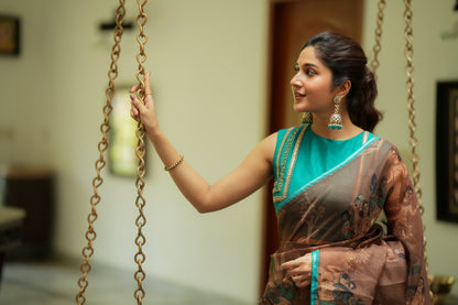 Brown kalamkari kota saree with blue hand work blouse