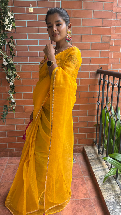 Yellow checked organza saree with velvet embroidery blouse