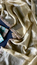 Golden soft tissue saree with blue floral embroidery blouse