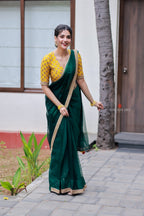 Green organza saree with yellow hand work blouse