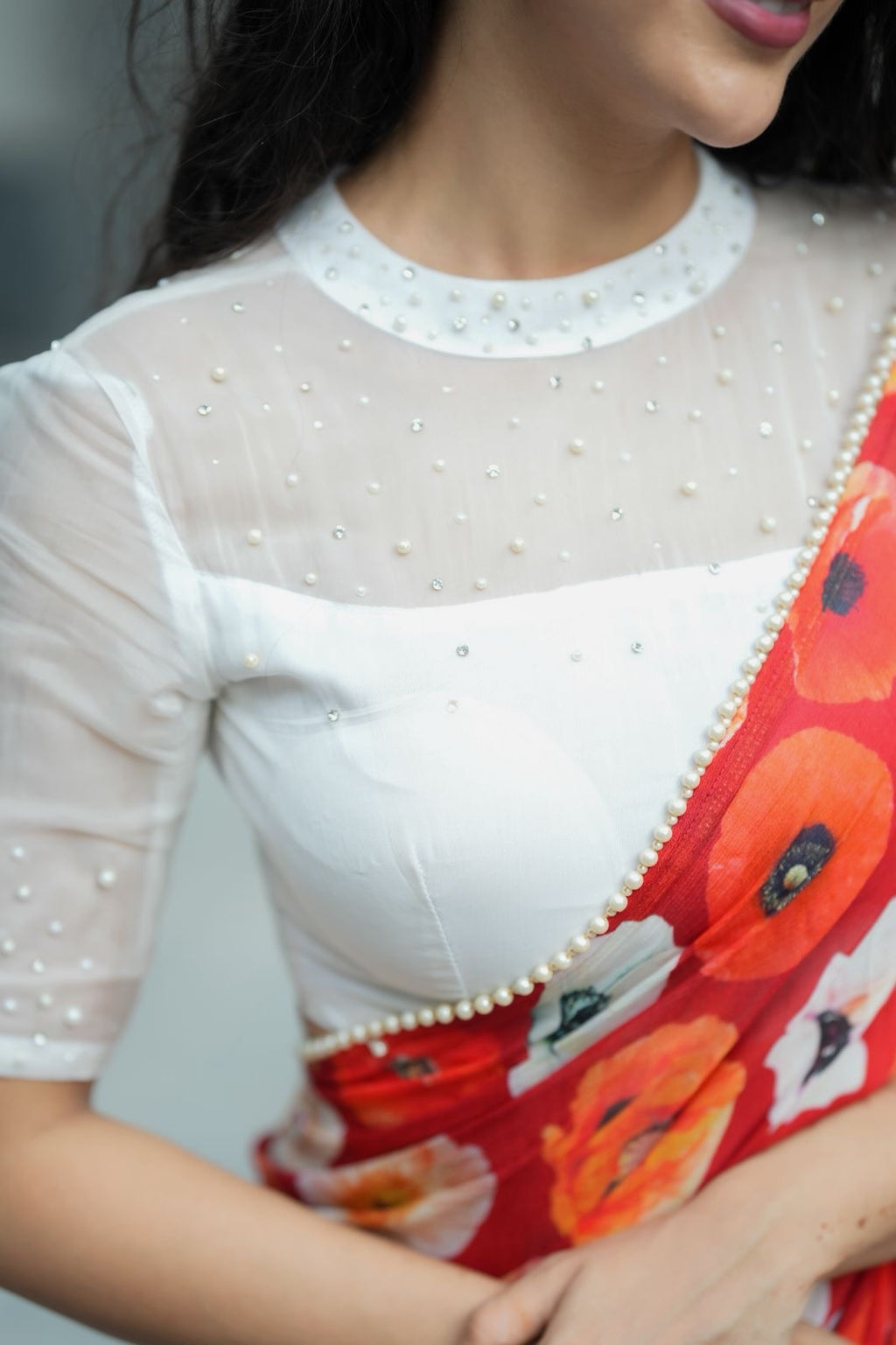 Orange red chinnon silk saree with white organza blouse