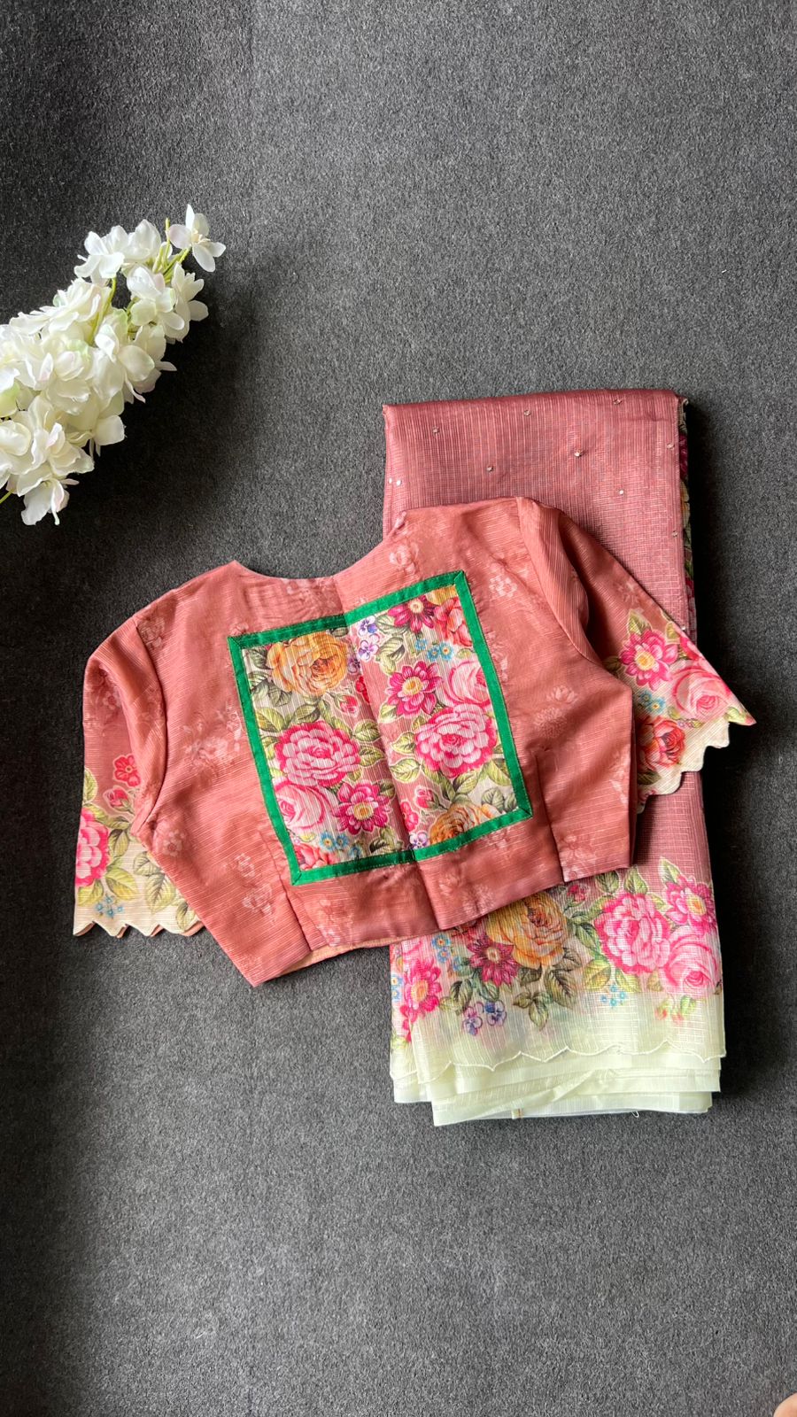 Peach floral kota doria saree with patterned blouse