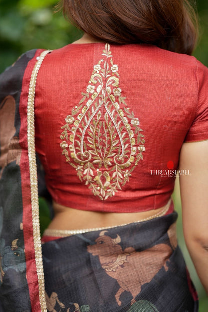 Black cow kota saree with paisley hand work blouse