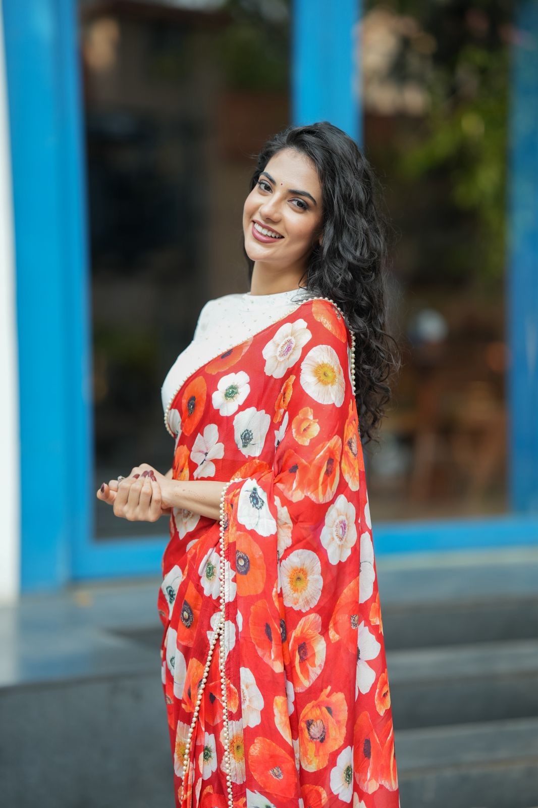 Orange red chinnon silk saree with white organza blouse