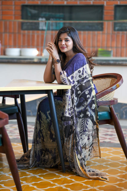 Purple kota saree with kalamkari work blouse