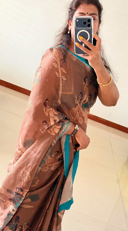 Brown kalamkari kota saree with blue hand work blouse