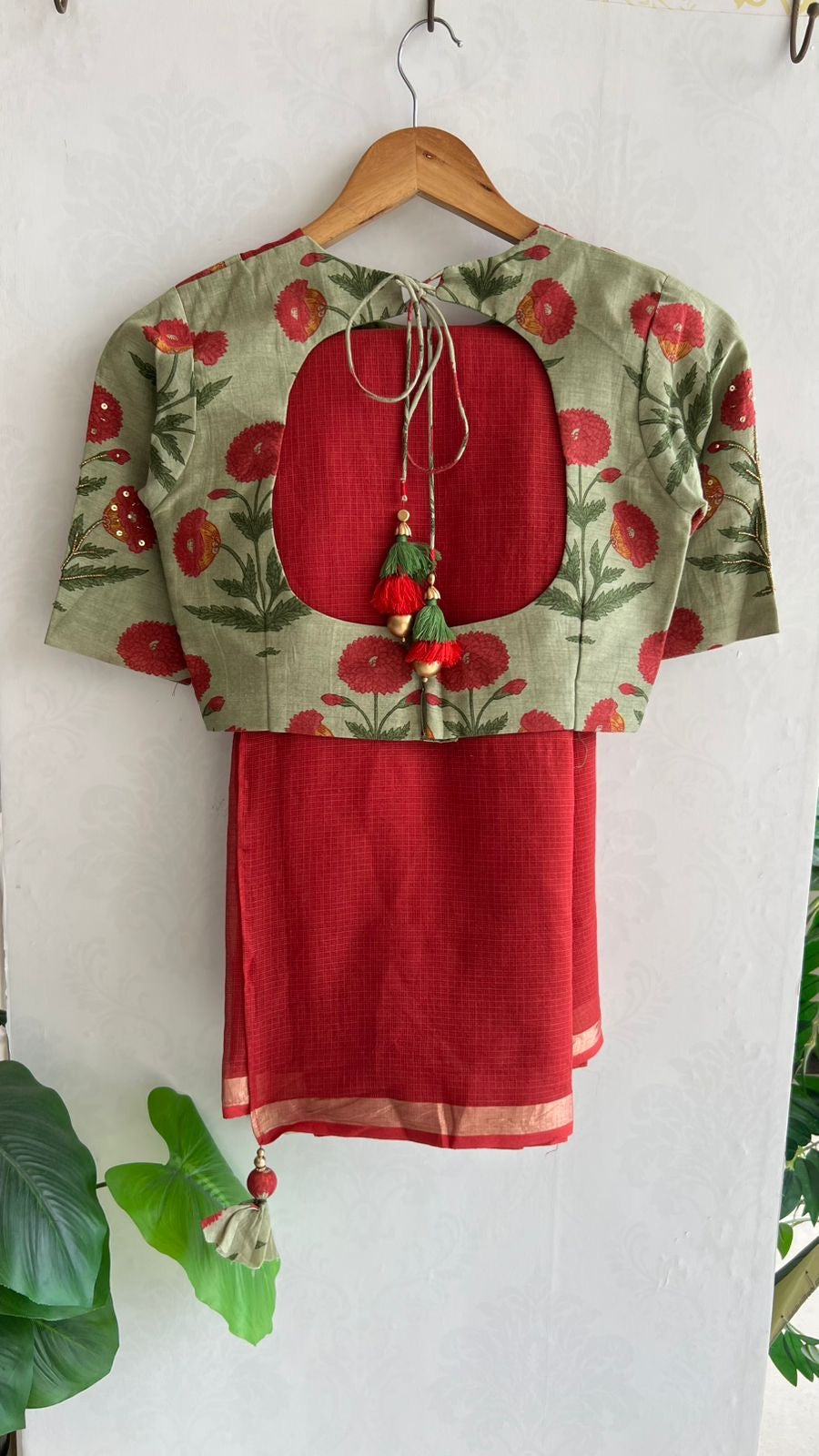 Maroon pure kota saree with green hand work blouse