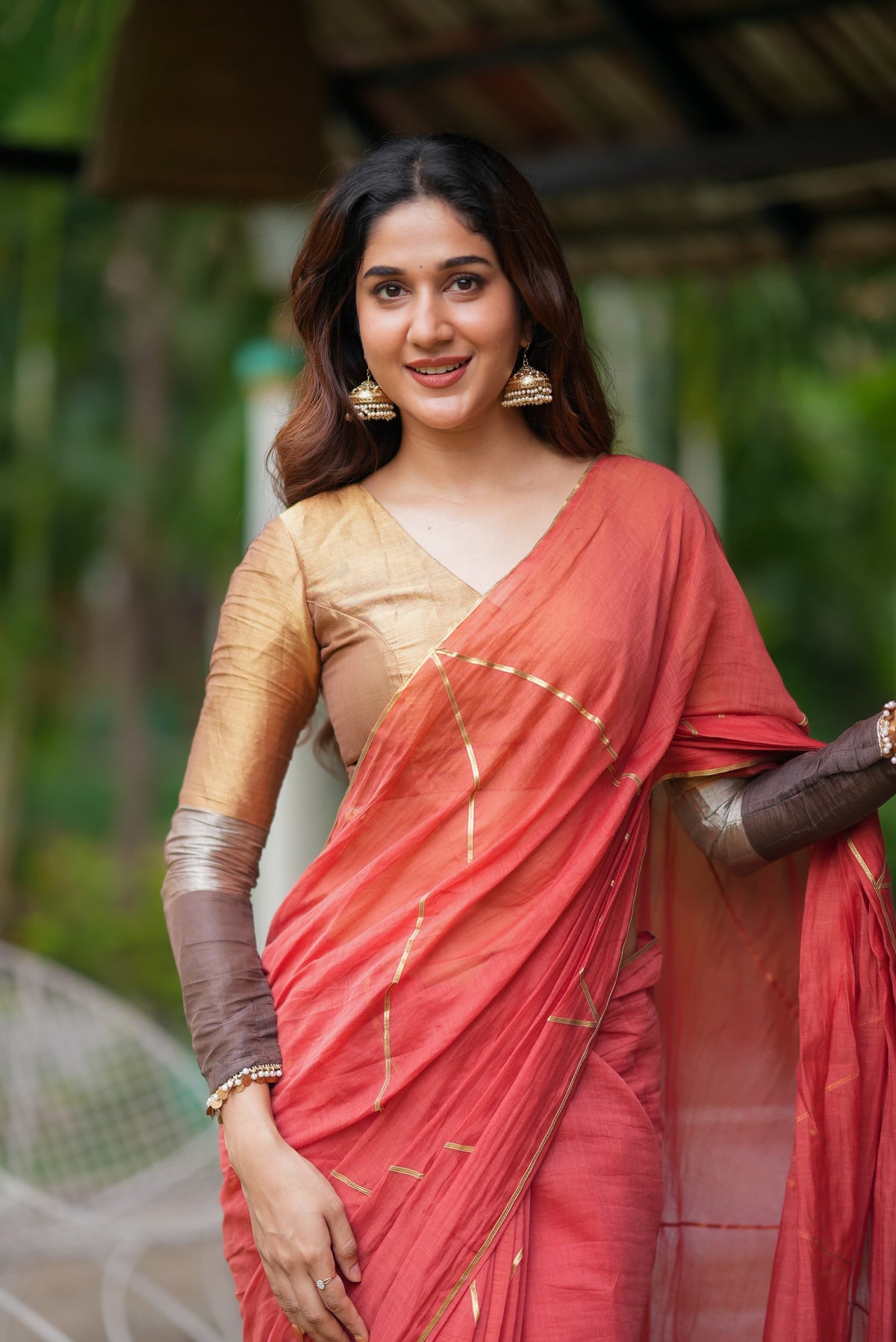 Orange rust saree with tissue handwork blouse