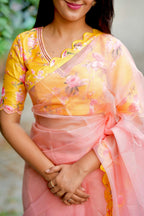 Peach organza saree with yellow floral hand work blouse