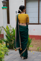 Green organza saree with yellow hand work blouse