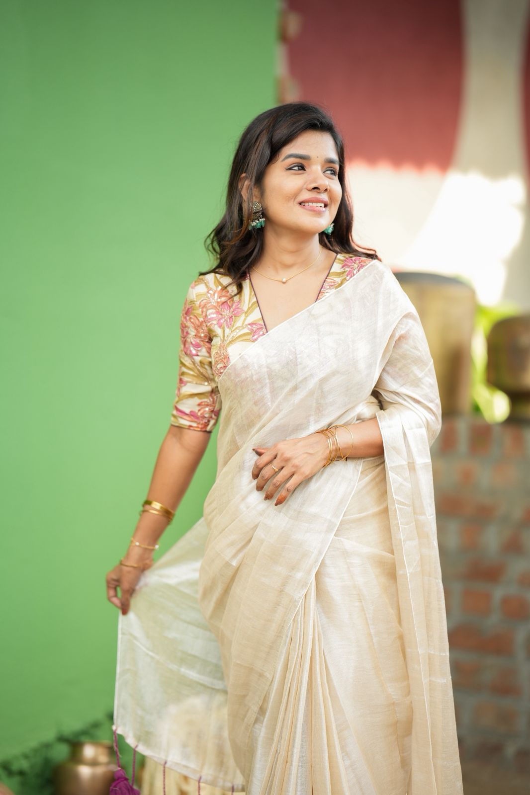 Cream soft tissue saree with embroidered blouse