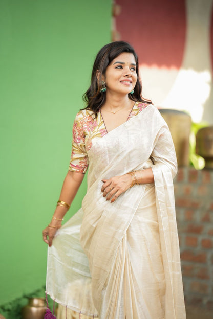 Cream soft tissue saree with embroidered blouse