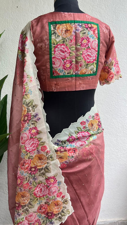 Peach floral kota doria saree with patterned blouse