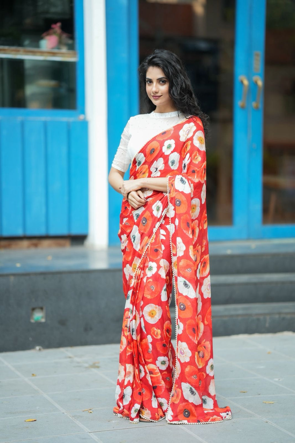Orange red chinnon silk saree with white organza blouse
