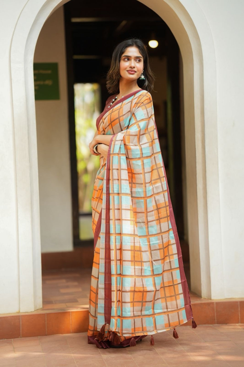 Multi checked kota saree with brown embroidery blouse