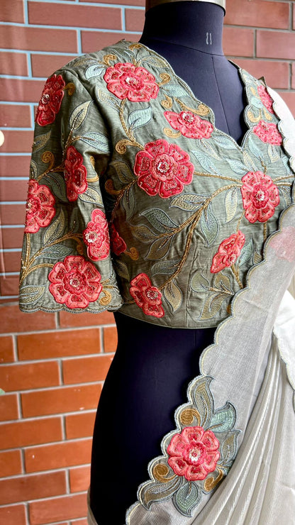 Half white textured organza saree with heavy handwork blouse