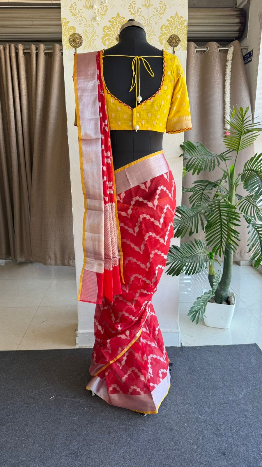 Red soft kota silk saree with yellow embroidered blouse