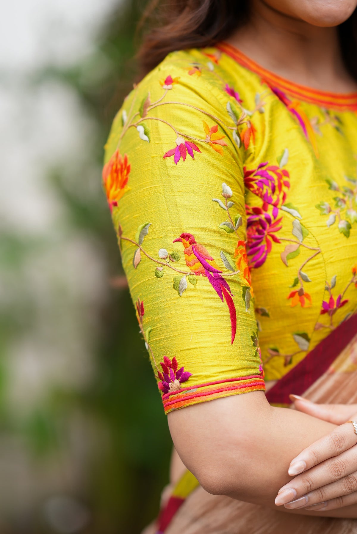 Antique gold tissue saree with parrot handwork blouse