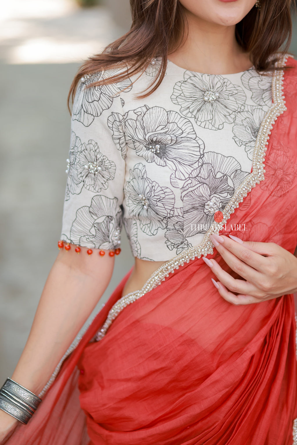 Orange rust saree with pearl work blouse
