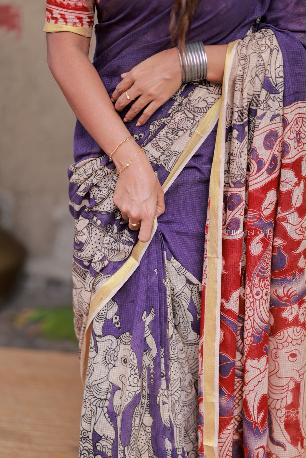 Purple kota saree with kalamkari work blouse