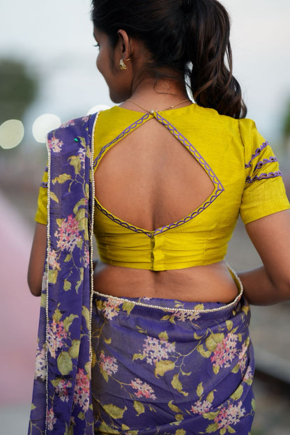 Blue floral tissue saree with lime hand work blouse