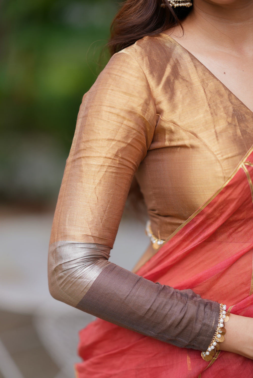 Orange rust saree with tissue handwork blouse