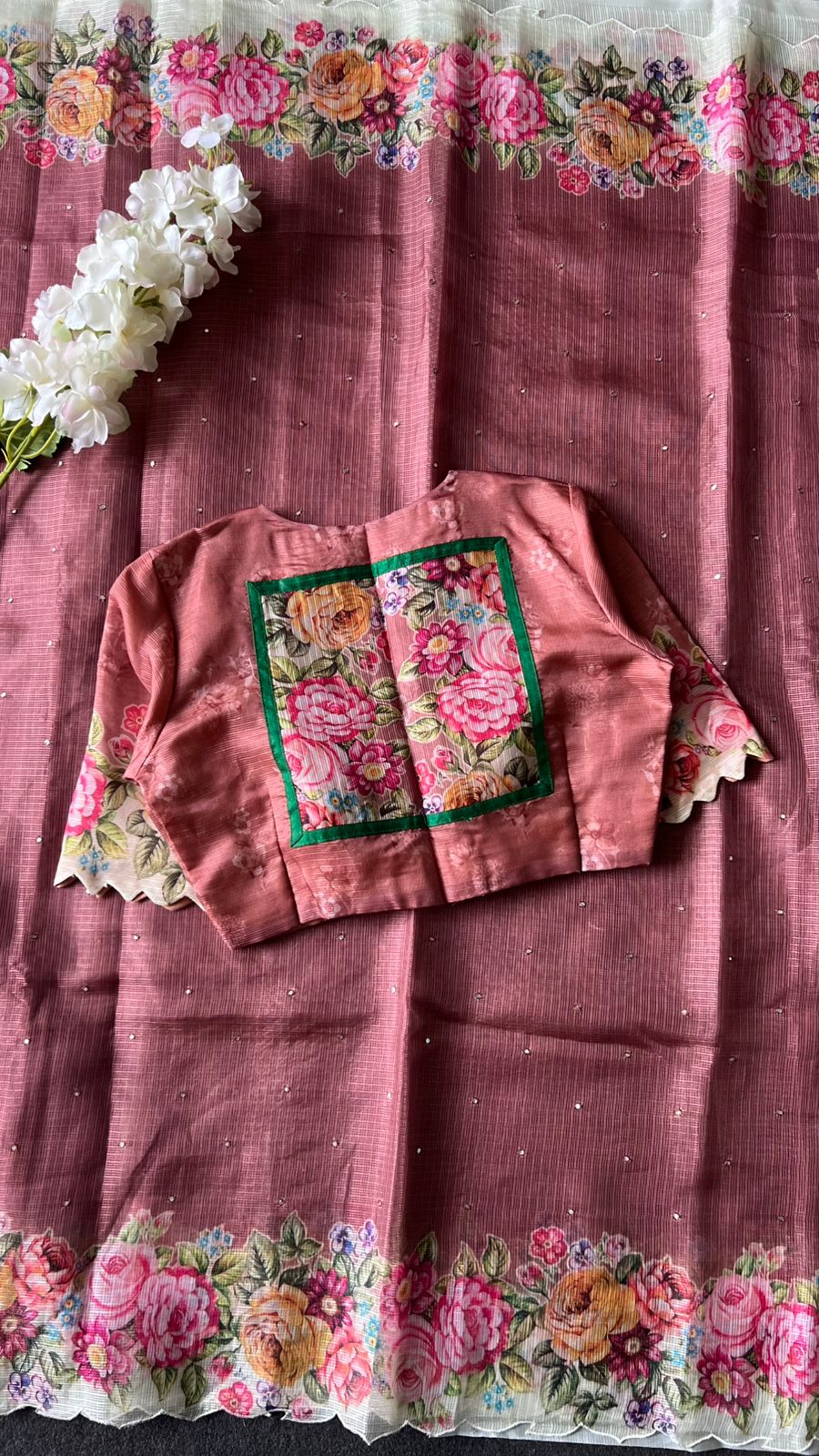 Peach floral kota doria saree with patterned blouse