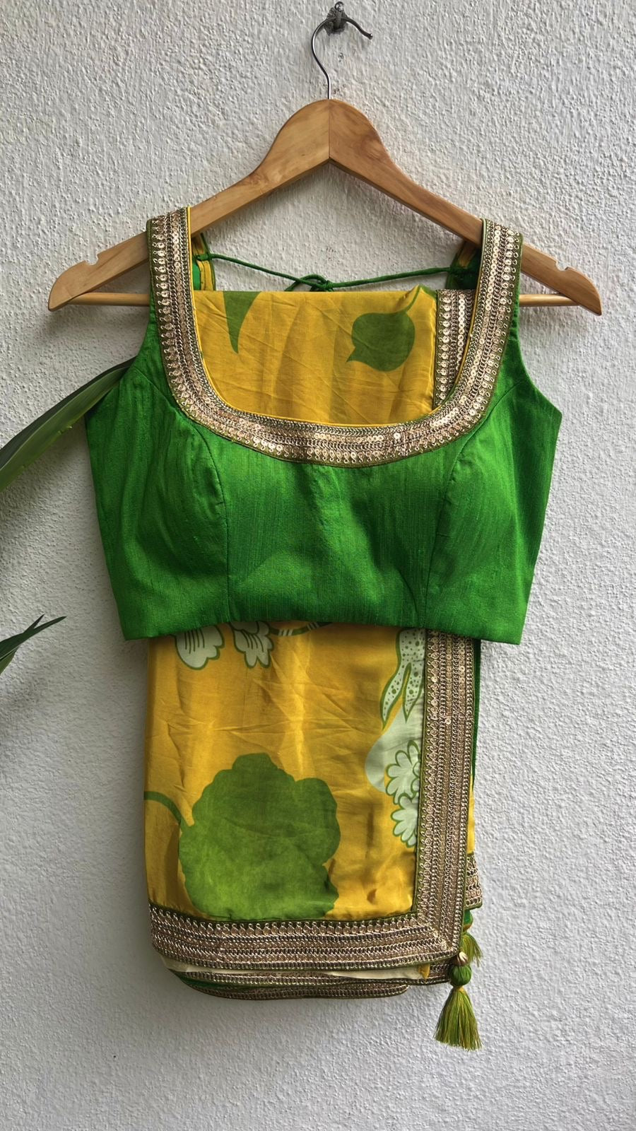 Yellow viscose saree with green silk embroidered blouse