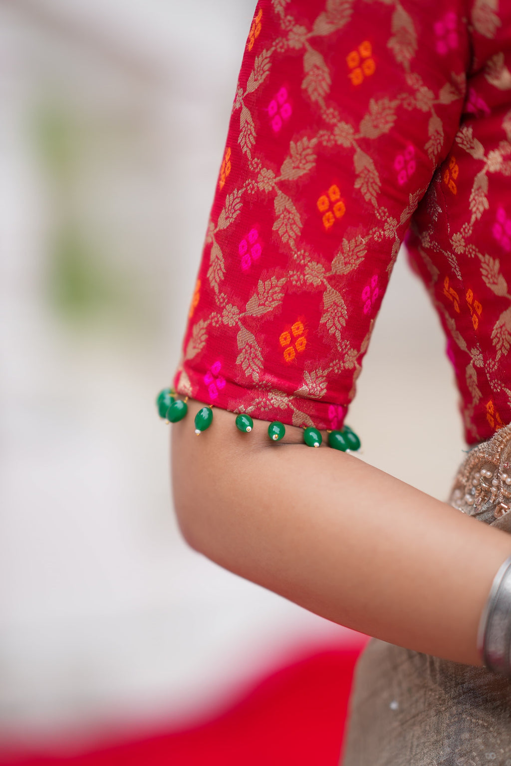 Grey tissue saree with red banarasi blouse