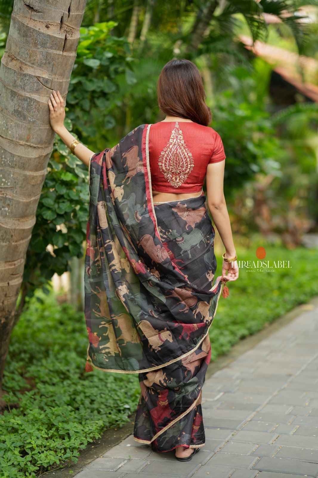 Black cow kota saree with paisley hand work blouse