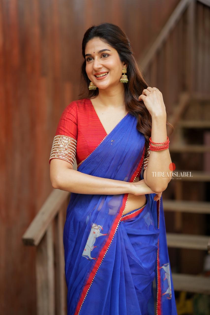 Blue organza cow with red hand work blouse