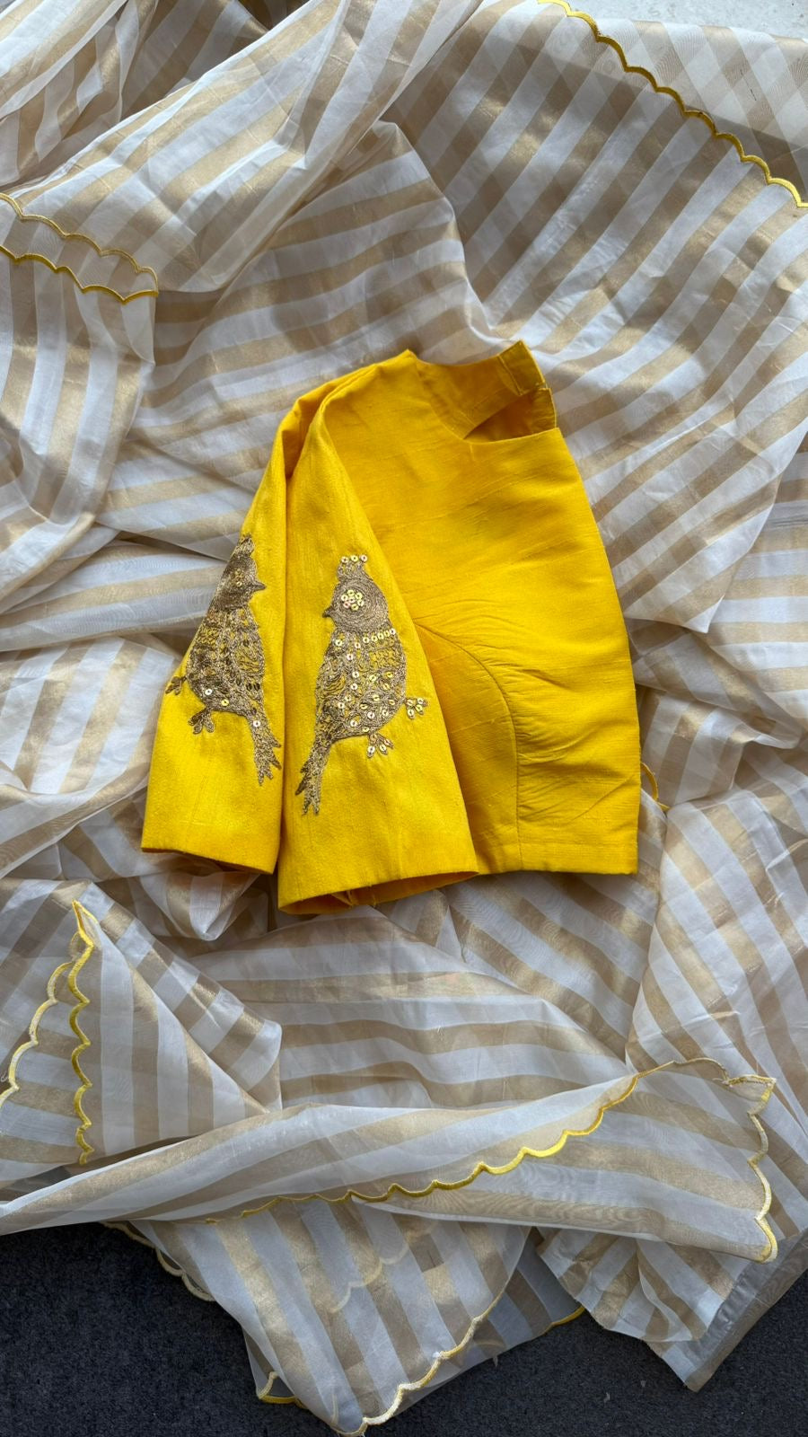 Yellow & cream stripped tissue saree with bird work blouse