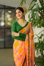 Orange viscose jute saree with green hakoba blouse