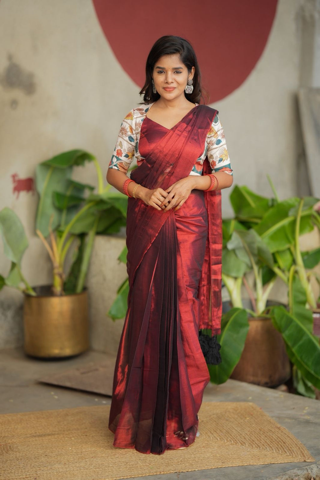 Wine soft tissue saree with floral blouse