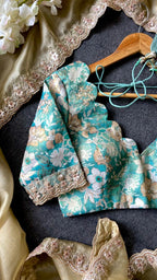 Golden soft tissue saree with blue floral embroidery blouse