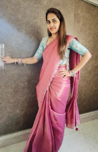 Pink soft tissue saree with blue hand worked blouse